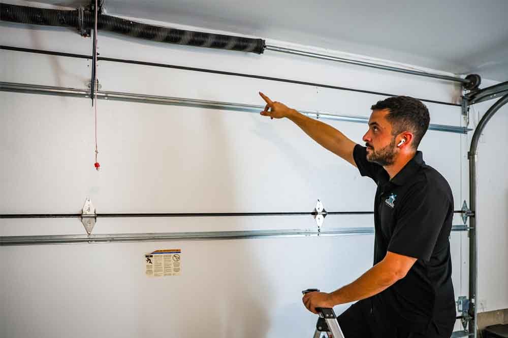 Sealing gaps and cracks in a garage for winter.